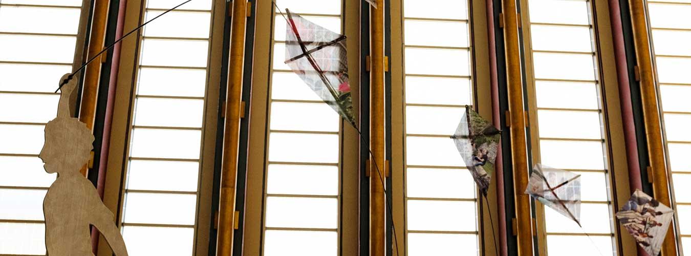 sculptural art depicting a child flying kites