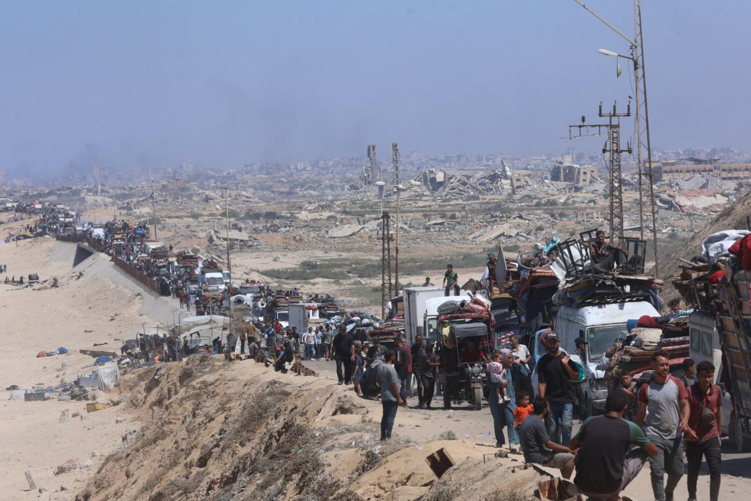 A group of displaced population transversing across a country.