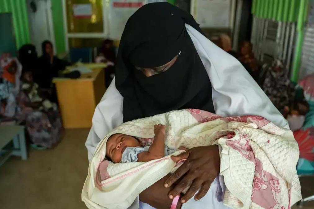 woman holding newborn