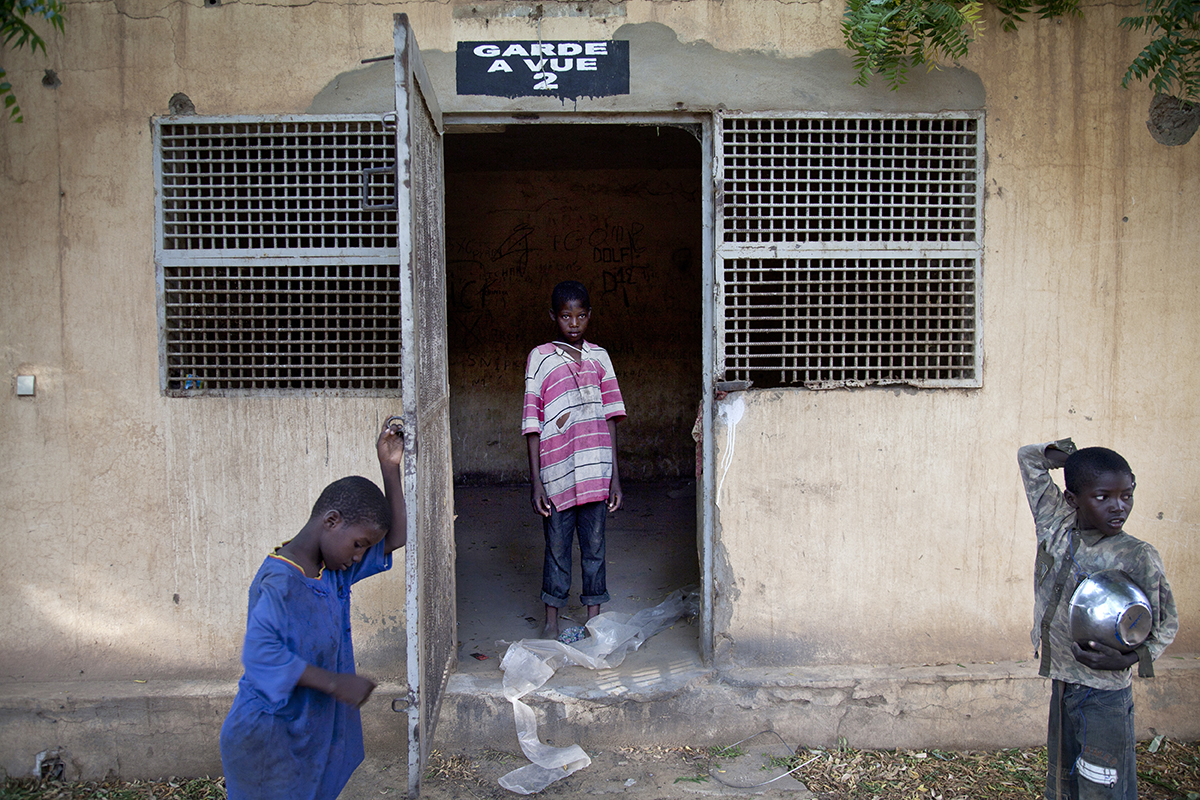children in and around jail cell