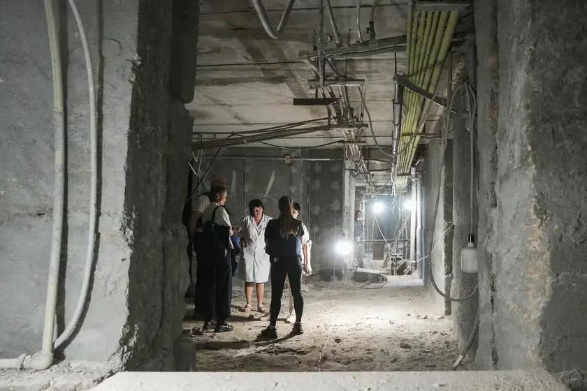 A group of medics meeting at an unfinished building.