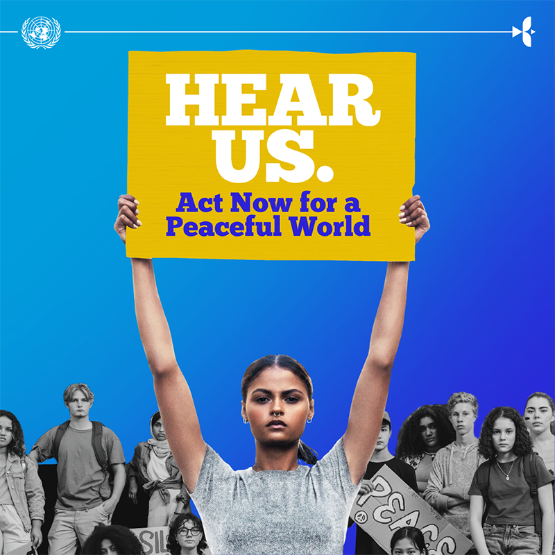 girl holding up sign, with other young people in the background