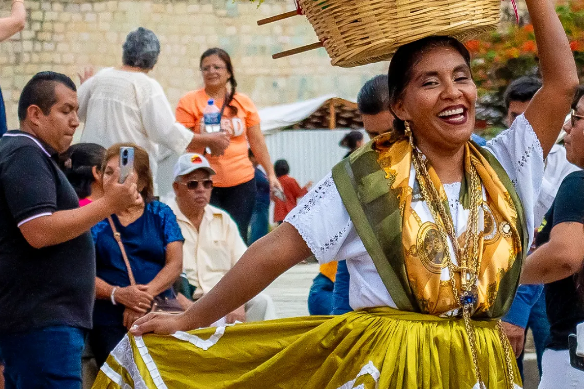 A woman dancing in the middle of a crowd.